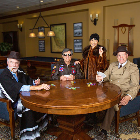 A group of Stoneridge Creek residents dress as film and fashion icons for photoshoot