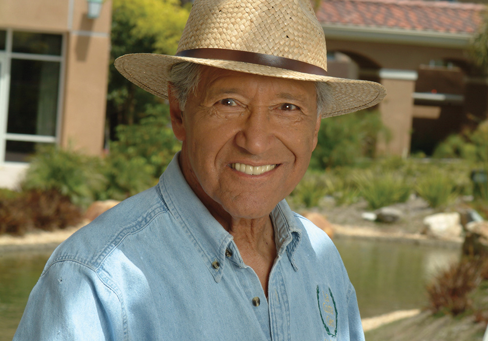 Man outdoors with a straw hat