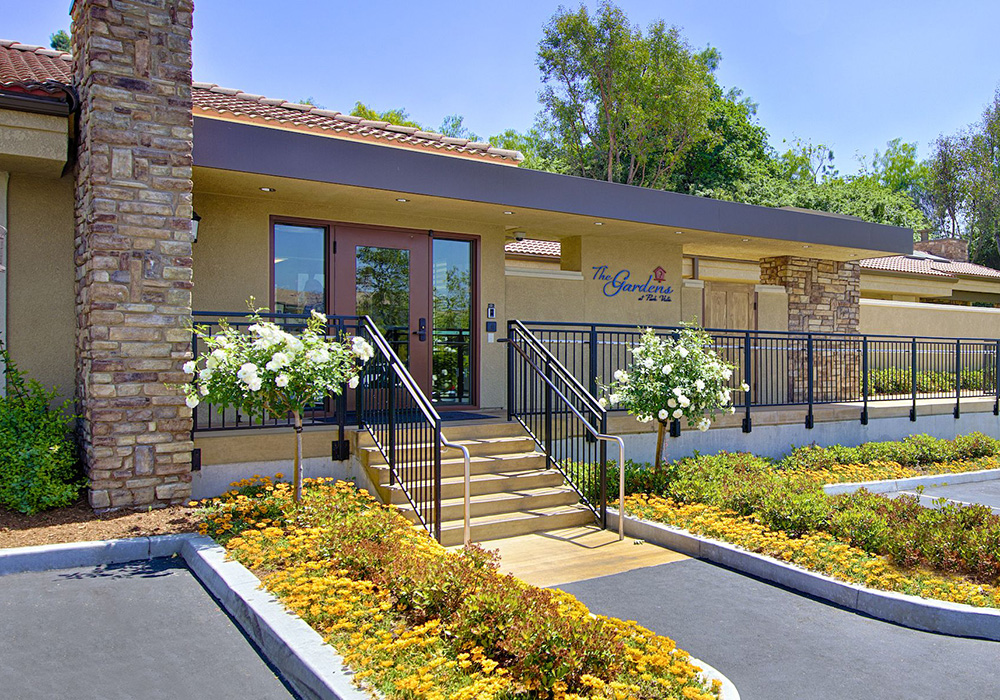 parkvista-1000x700-5 Front of The Gardens with yellow flowers and white flowered trees