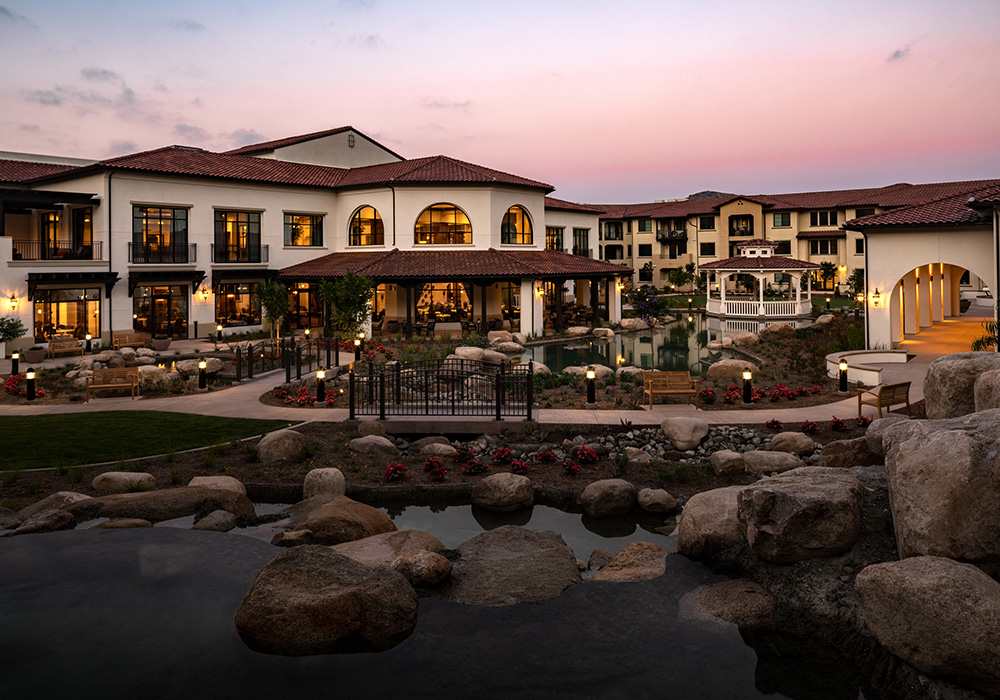 Sunset view of Reata Glen with pond and gazebo