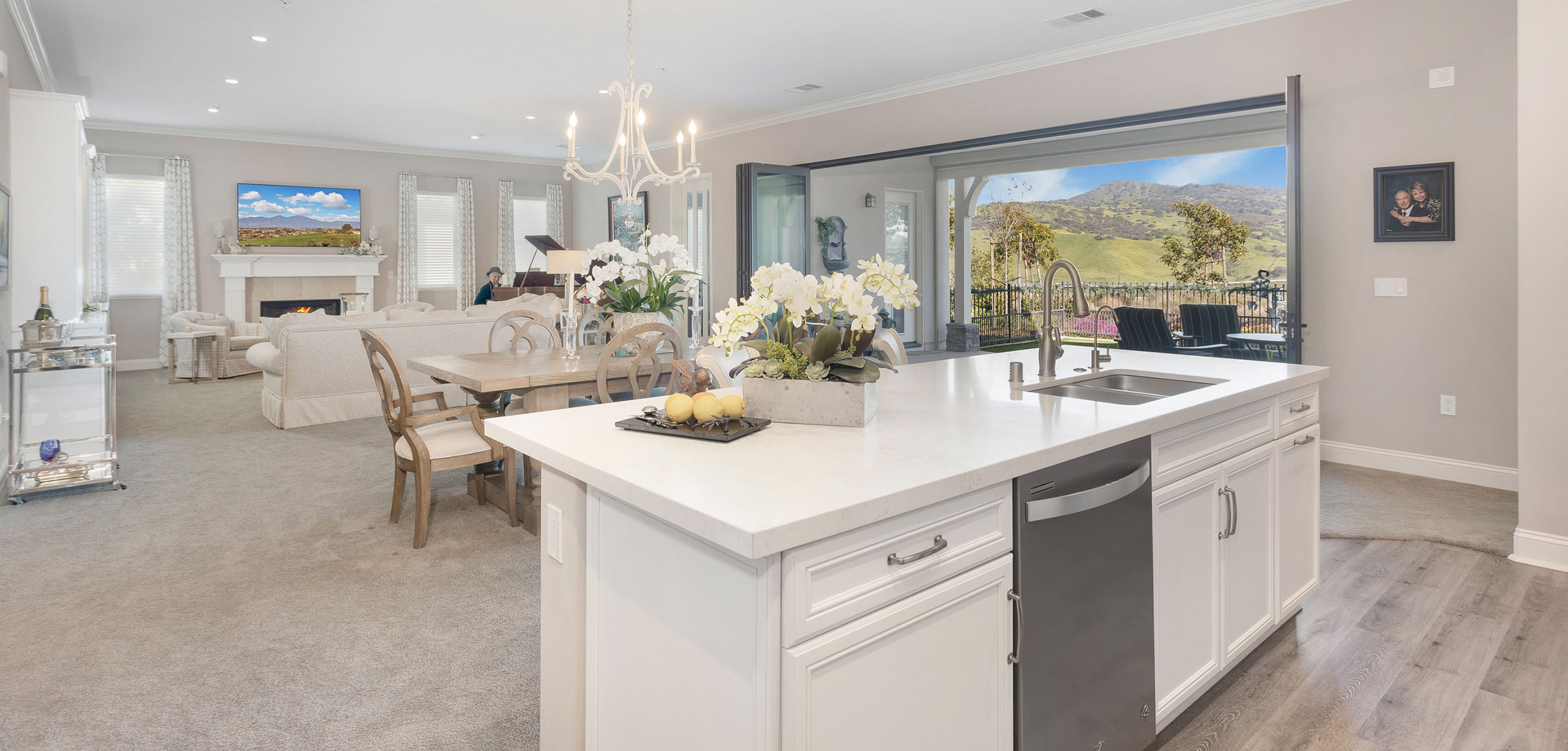 REATA-YellowJackets33-980x735 A villa floor plan as seen from the kitchen looking into the living room and open door view of the hills
