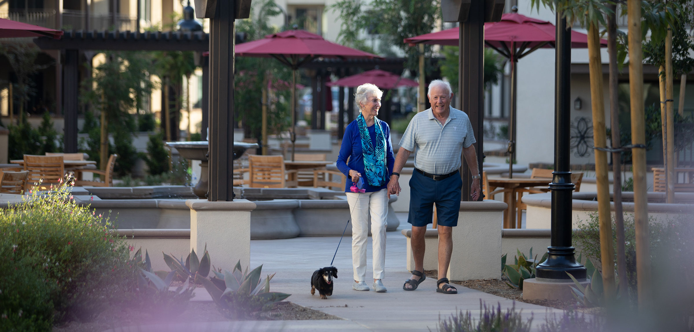 A couple walking in the courtyard of Reata Glen