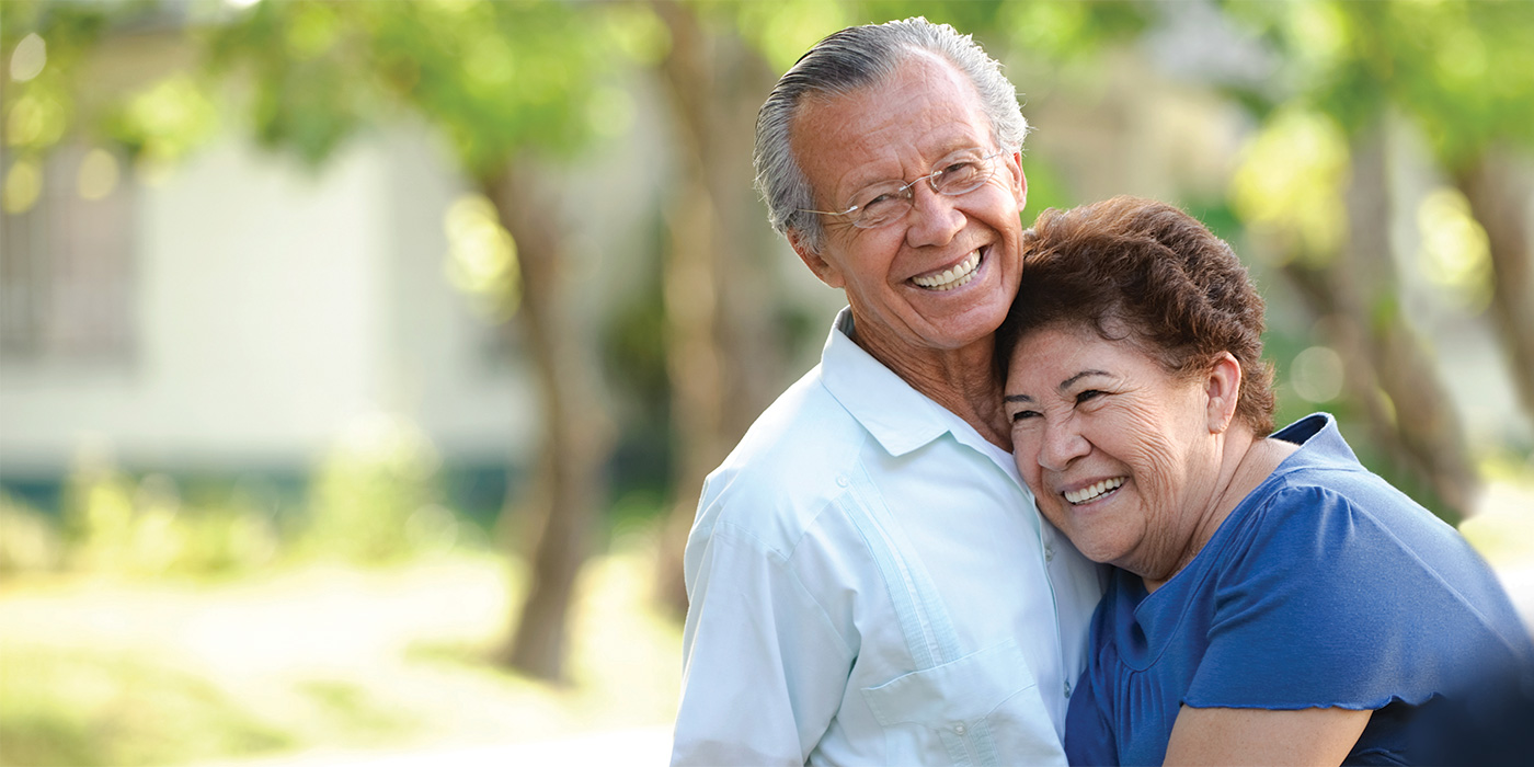 reata-2023-1400x700-42 A couple smiling and hugging outside