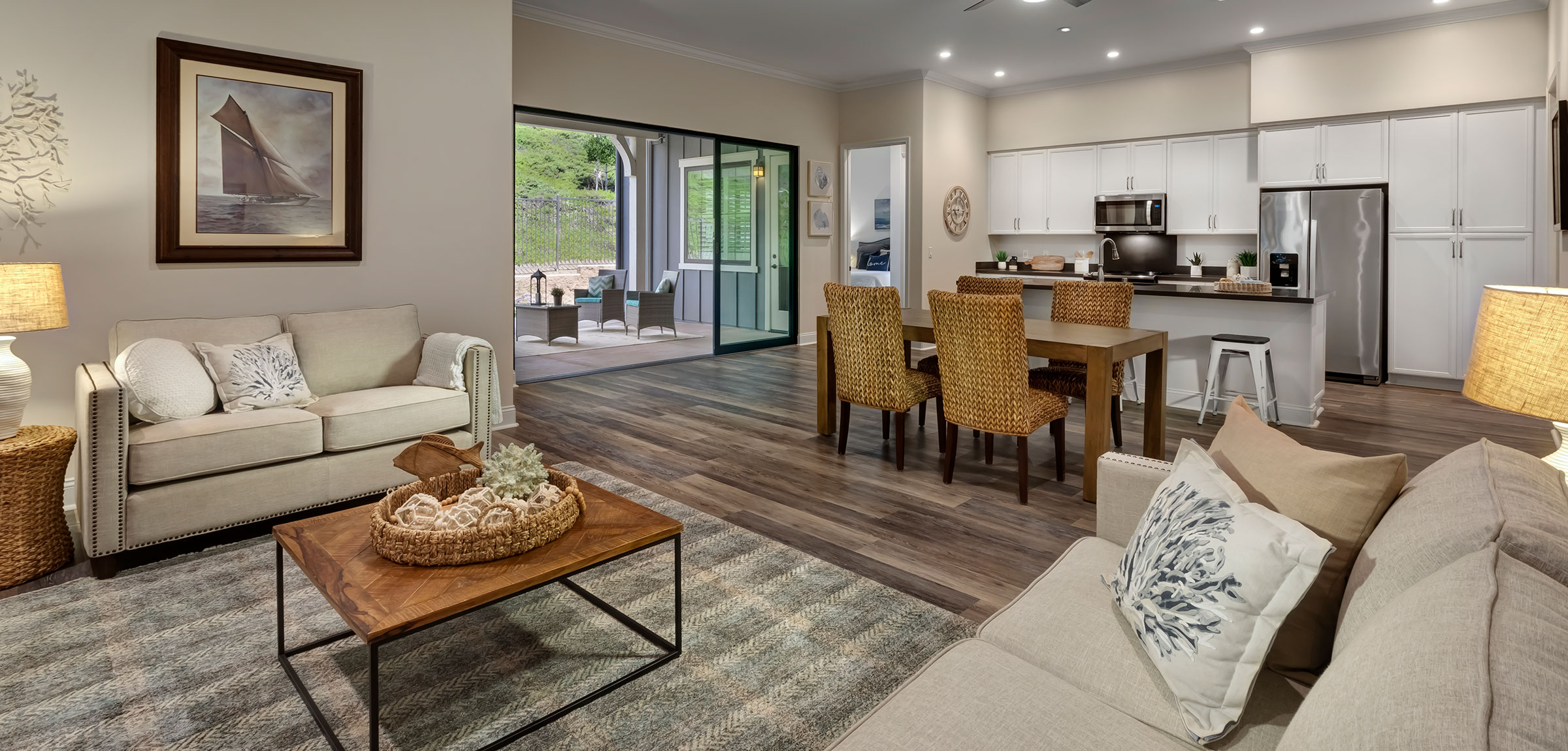 ReataGlen-24-600x600-2 A living room at Reata Glen with a large indoor outdoor area