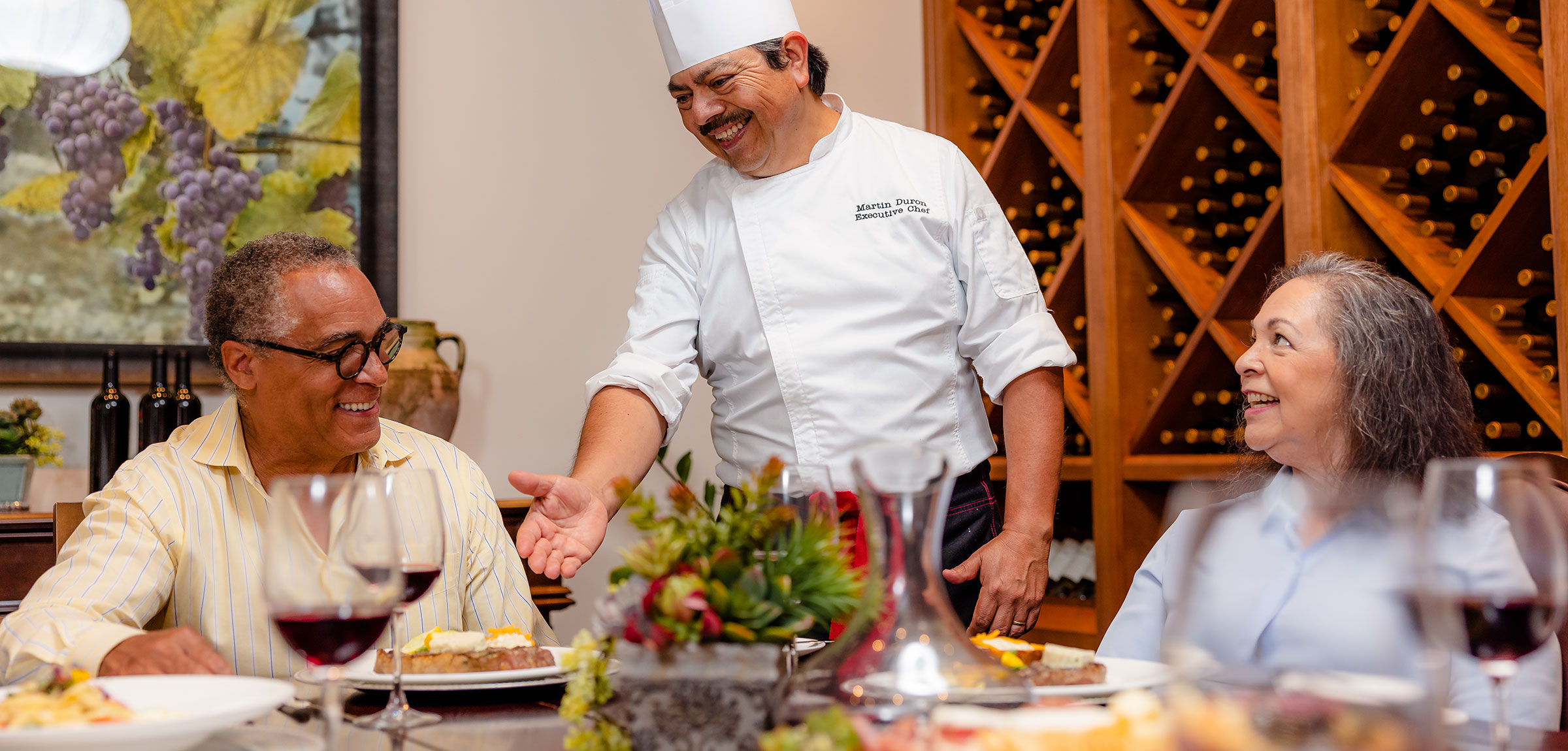 A chef talking to customers at The Glen at Scripps Ranch