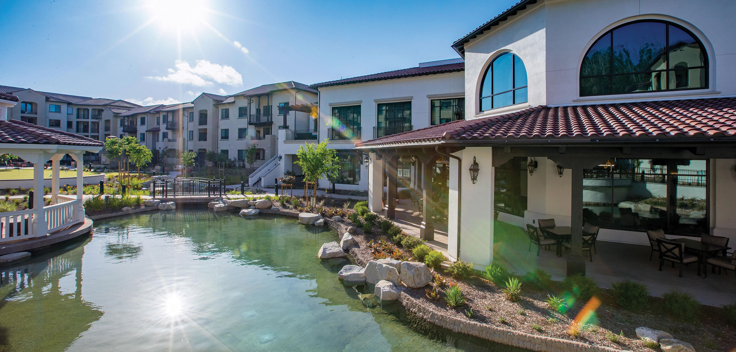 Apartments and a pond at The Glen at Scripps Ranch