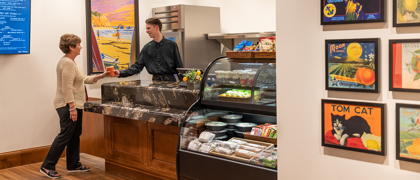 reata-2023-1400x600-37 Woman getting take out from a counter at La Costa Glen