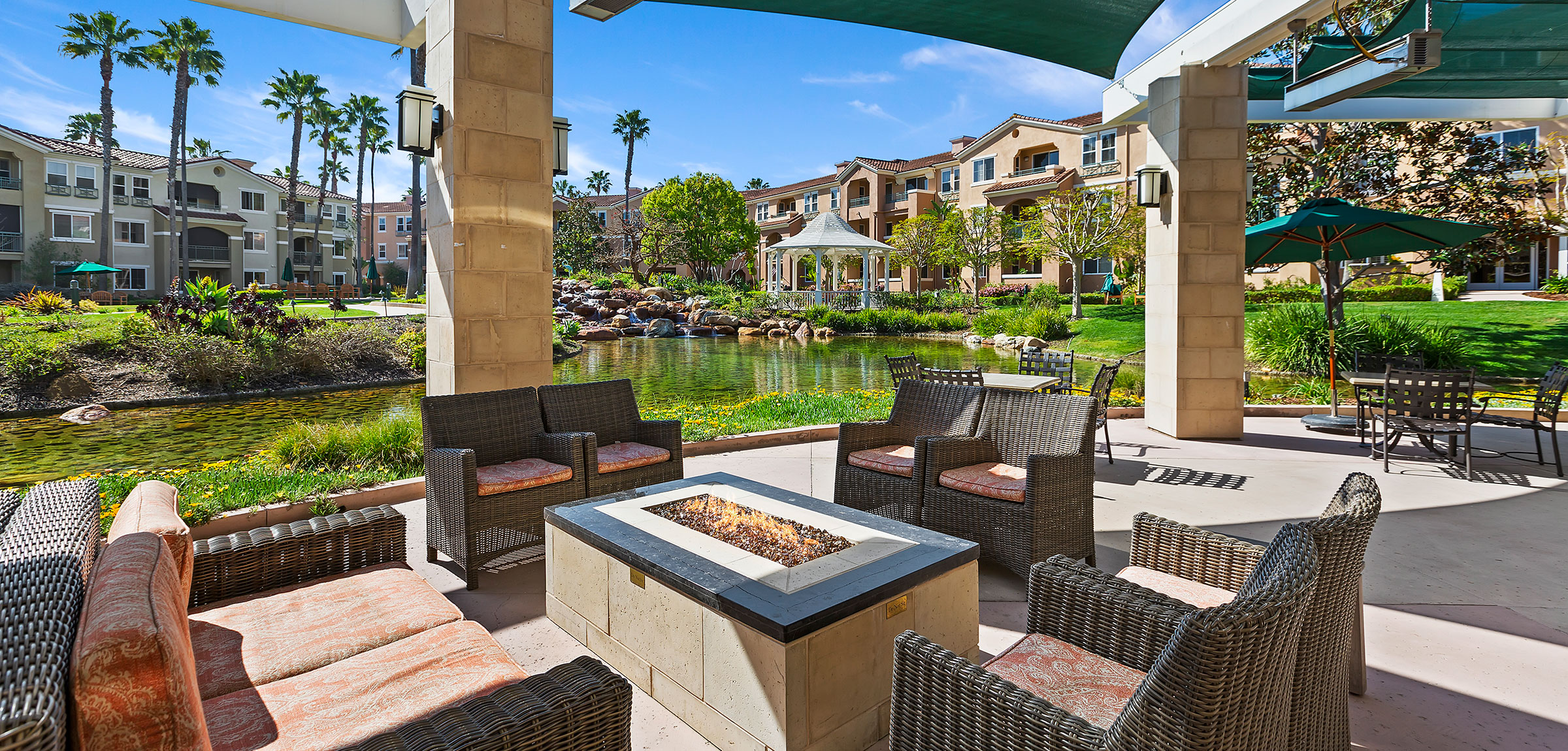 Outdoor seating area on a patio with a fire pit