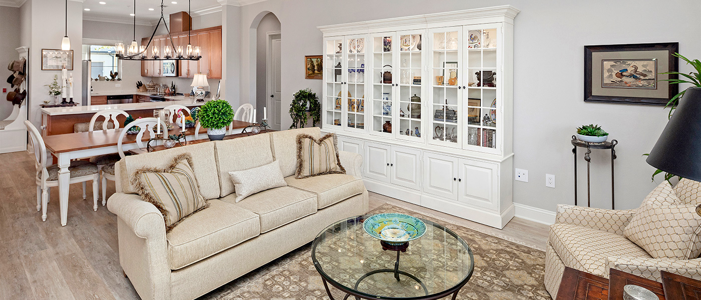TheGlen-1400x600-22 Living room with white sofa and white bookcase