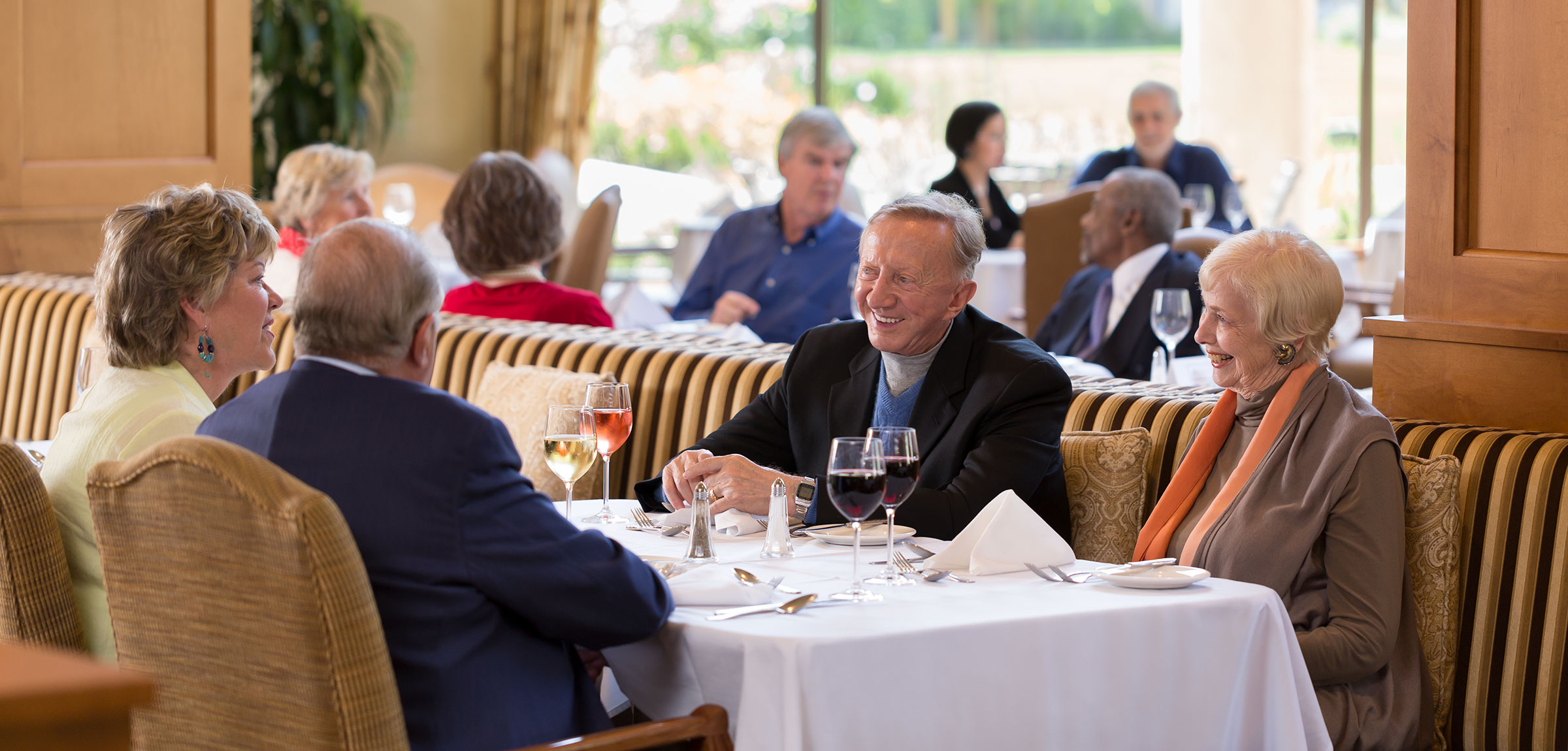 Elderly residents at a restaurant at Stoneridge Creek